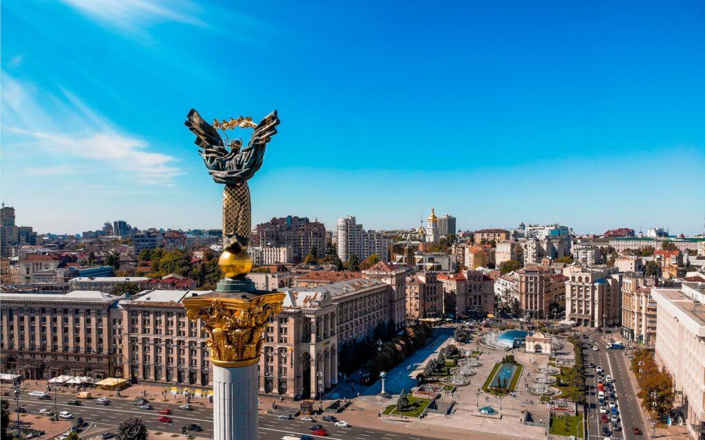 Russia Ukraine War a view of a city in Ukraine with a statue in the middle